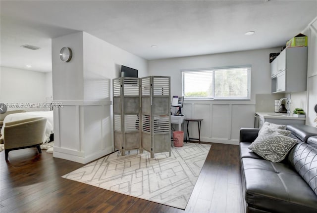 living room featuring dark hardwood / wood-style flooring