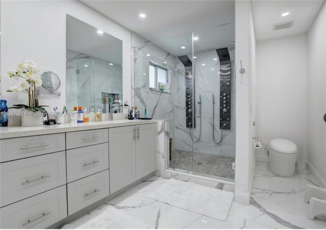 bathroom featuring toilet, a shower with door, and vanity