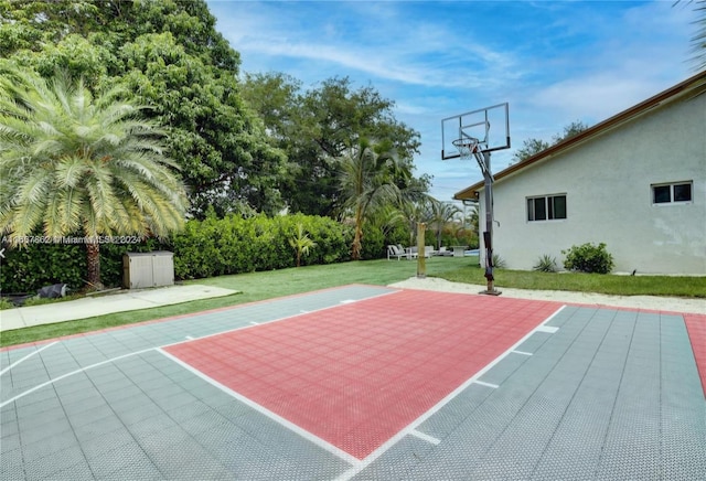 view of basketball court featuring a lawn