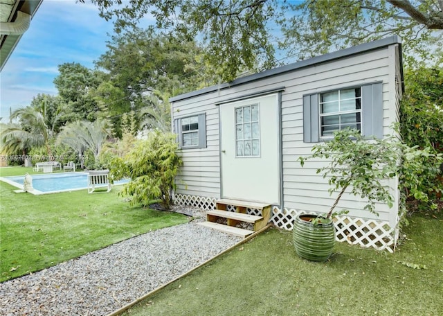 view of outdoor structure featuring a yard