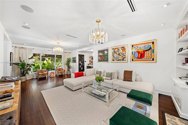 living area with an inviting chandelier, recessed lighting, wood finished floors, and visible vents