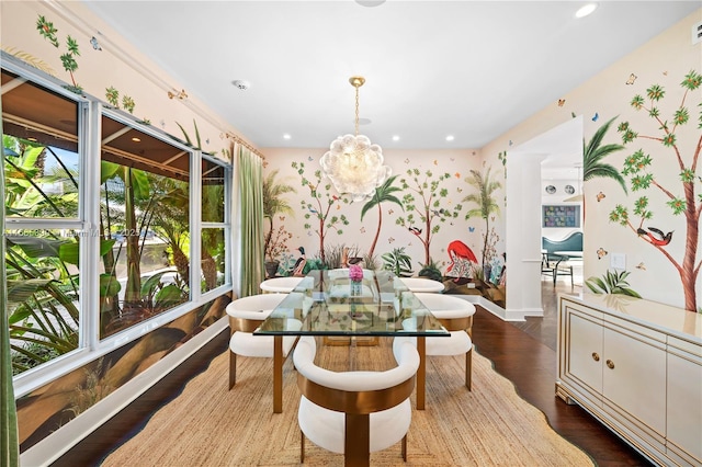 dining room with recessed lighting, wallpapered walls, dark wood-type flooring, and an inviting chandelier