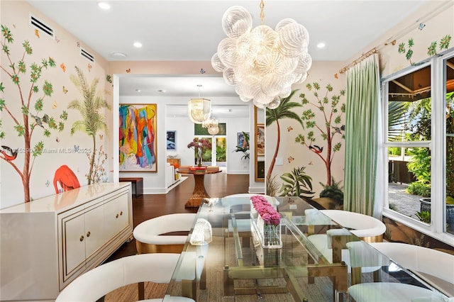 dining area featuring a notable chandelier, recessed lighting, visible vents, and wood finished floors