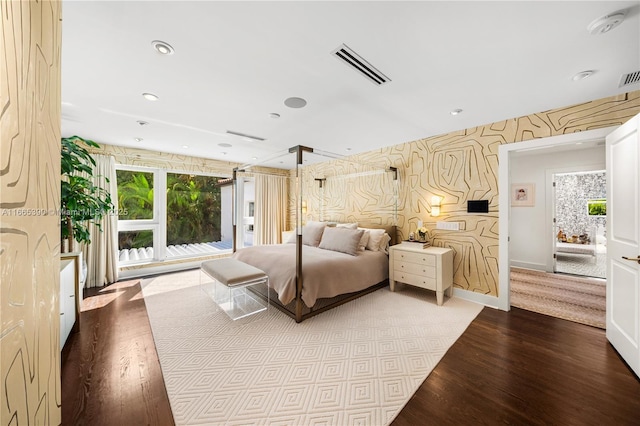 bedroom with recessed lighting, visible vents, wood finished floors, and wallpapered walls