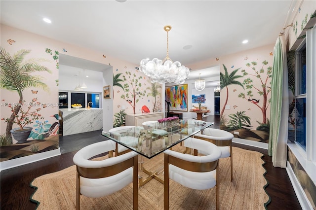 dining area featuring wallpapered walls, recessed lighting, wood finished floors, and a chandelier