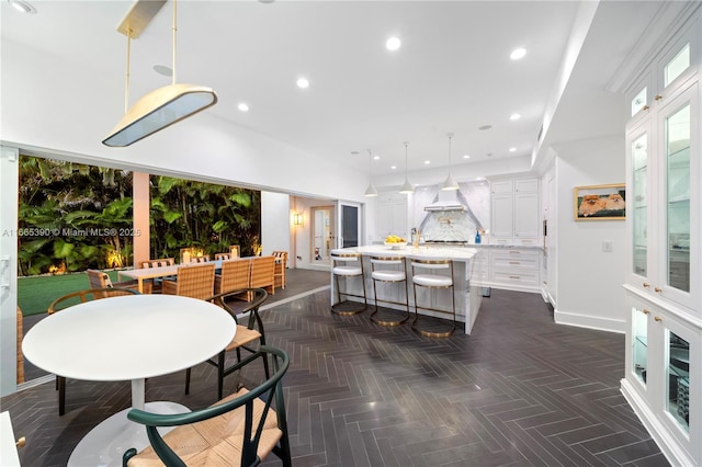 dining area with recessed lighting and baseboards