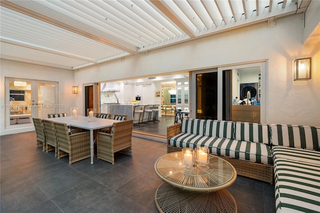 interior space with french doors and dark tile patterned flooring