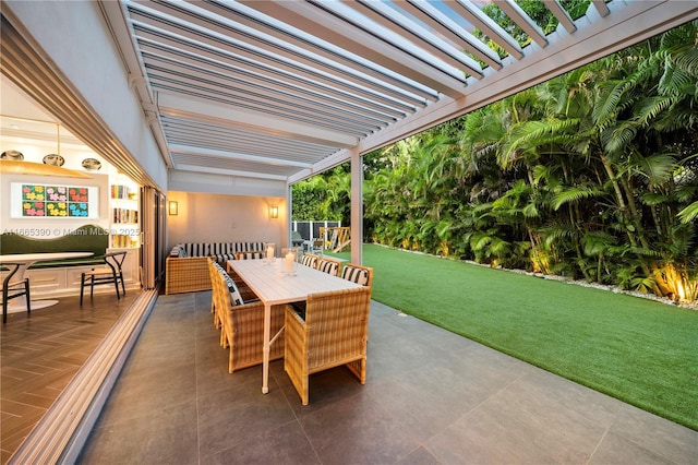 view of patio / terrace with a pergola and outdoor dining area