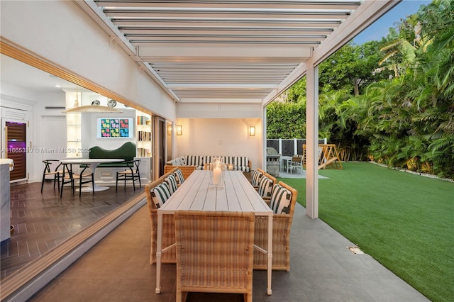 view of patio / terrace featuring a pergola and outdoor dining area