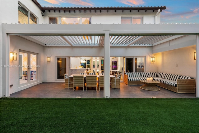 back of house with an outdoor living space, french doors, a lawn, and stucco siding