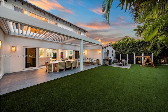 view of yard with an outdoor living space, a playground, a patio area, and a pergola