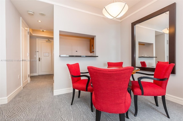 dining space featuring carpet