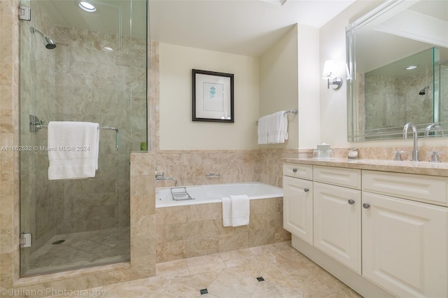 1435 Brickell Ave Unit 3603, Miami, FL 33131 - bathroom with vanity, a stall shower, and a garden tub
