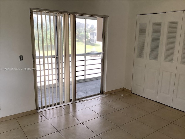 entryway with light tile patterned floors