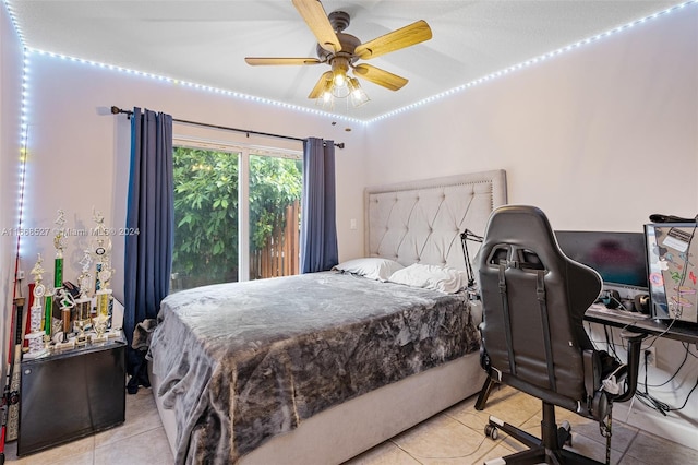 bedroom featuring ceiling fan and light tile patterned floors