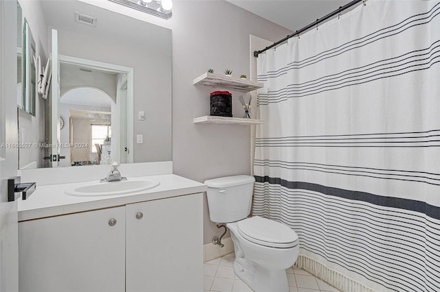 bathroom featuring tile patterned flooring, vanity, toilet, and a shower with curtain