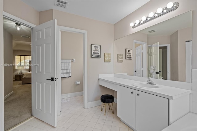 bathroom featuring tile patterned floors and vanity