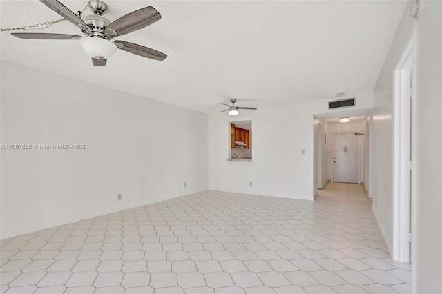 unfurnished living room with ceiling fan