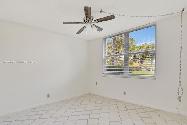 spare room with ceiling fan