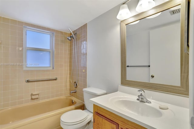 full bathroom with vanity, toilet, and tiled shower / bath combo