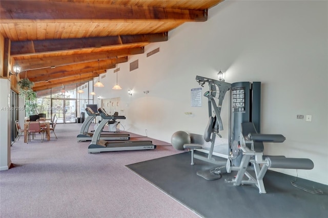 exercise room featuring carpet floors, wood ceiling, and vaulted ceiling