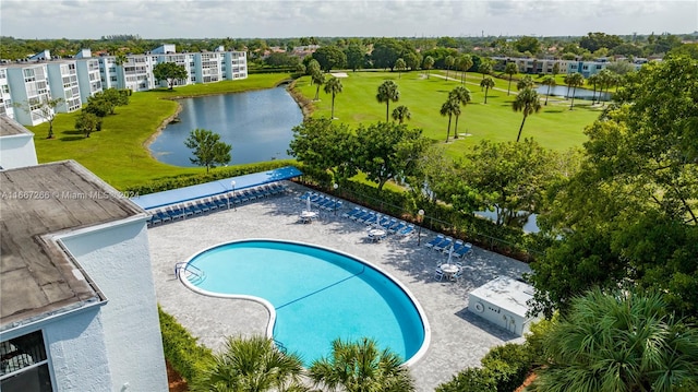 view of swimming pool with a water view