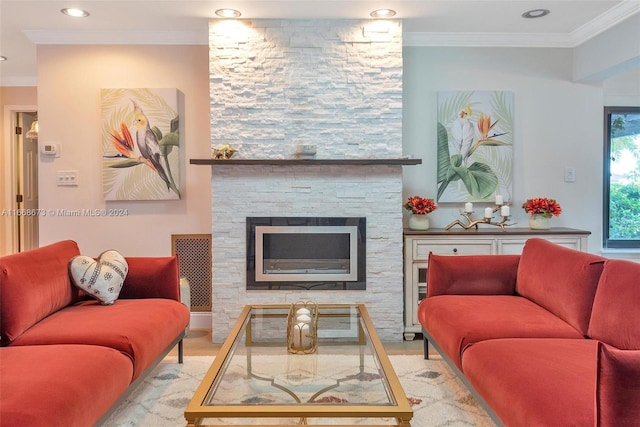 living room featuring crown molding and a stone fireplace