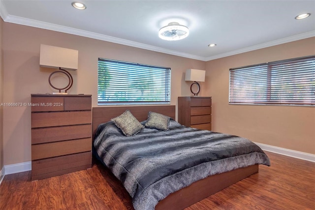 bedroom featuring ornamental molding and dark wood-type flooring