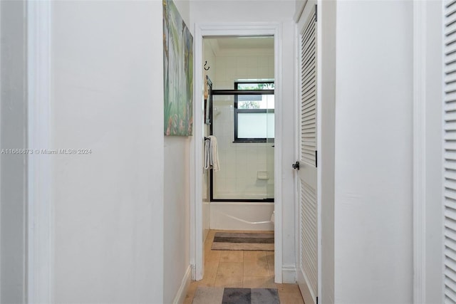 hall with light tile patterned flooring