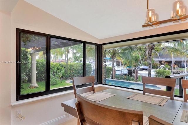 dining space featuring lofted ceiling