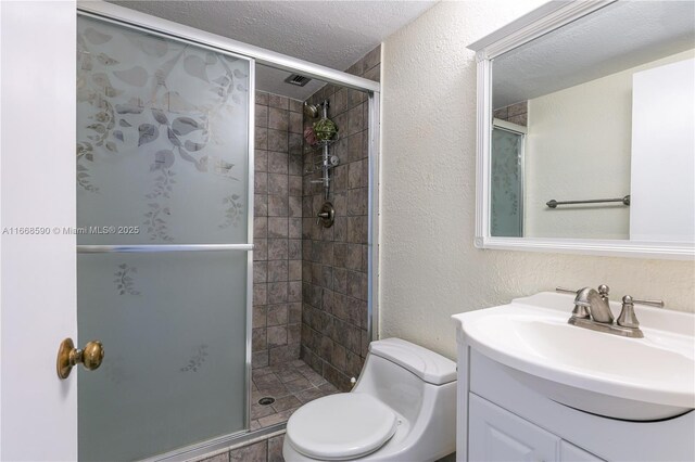 3800 S Ocean Dr Unit 811, Hollywood, FL 33019 - bathroom featuring vanity, a shower stall, toilet, and a textured ceiling
