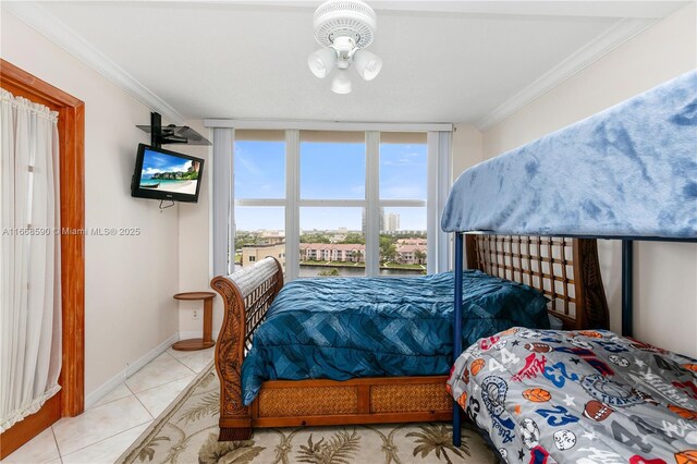 3800 S Ocean Dr Unit 811, Hollywood, FL 33019 - bedroom featuring ornamental molding, tile patterned flooring, and baseboards