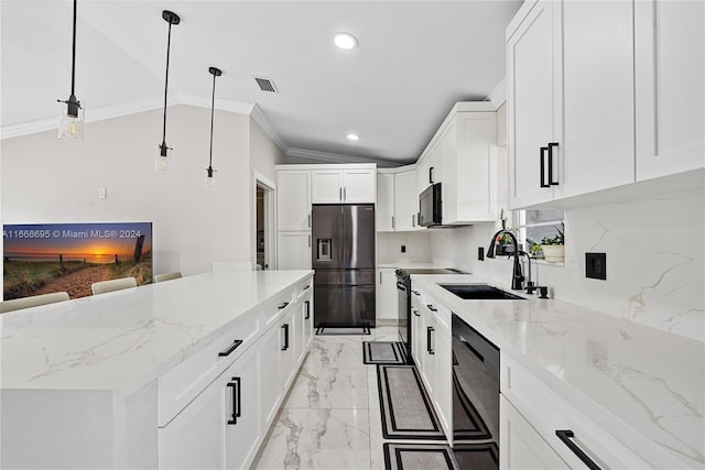 kitchen featuring decorative backsplash, vaulted ceiling, black appliances, white cabinetry, and hanging light fixtures