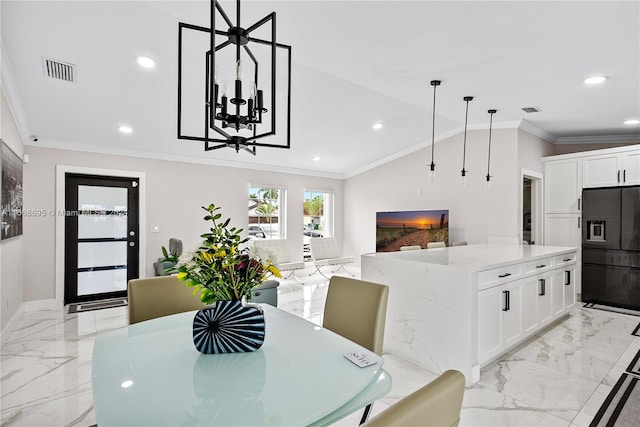 dining space featuring lofted ceiling and ornamental molding