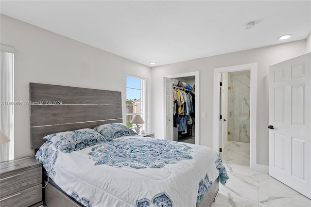 bedroom featuring a walk in closet, connected bathroom, and a closet