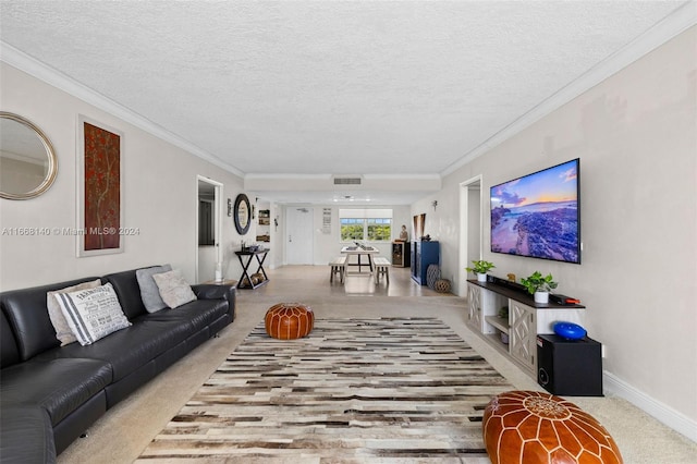 living room with ornamental molding, a textured ceiling, and light carpet