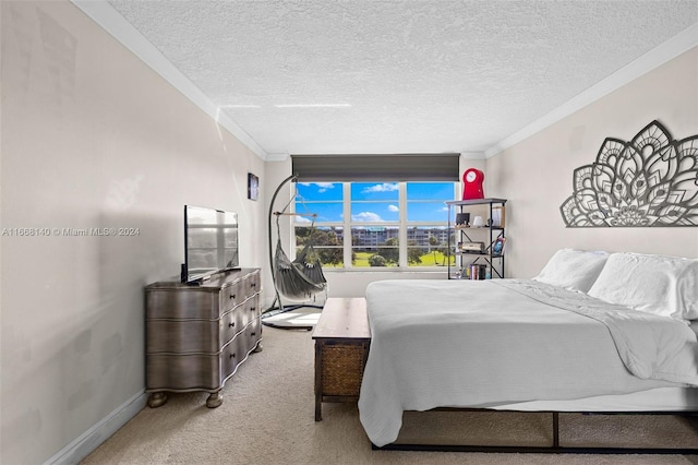 bedroom featuring a textured ceiling, ornamental molding, and light carpet