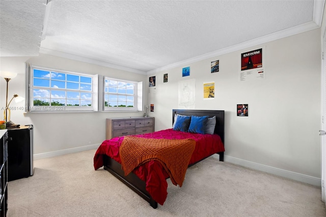 carpeted bedroom with a textured ceiling and ornamental molding