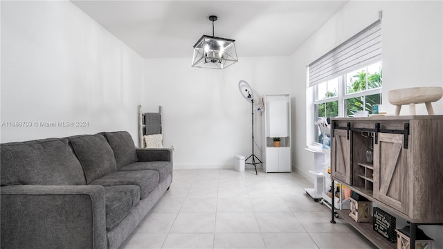 kitchen featuring pendant lighting, white cabinets, appliances with stainless steel finishes, and a kitchen bar