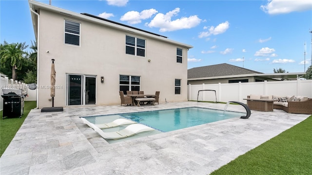 view of pool featuring a water view and a patio area