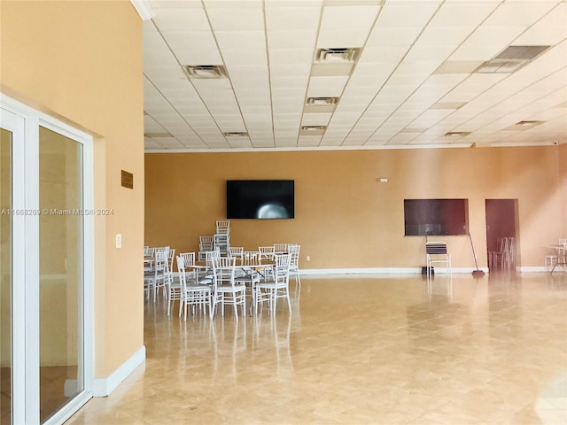 dining area with a drop ceiling