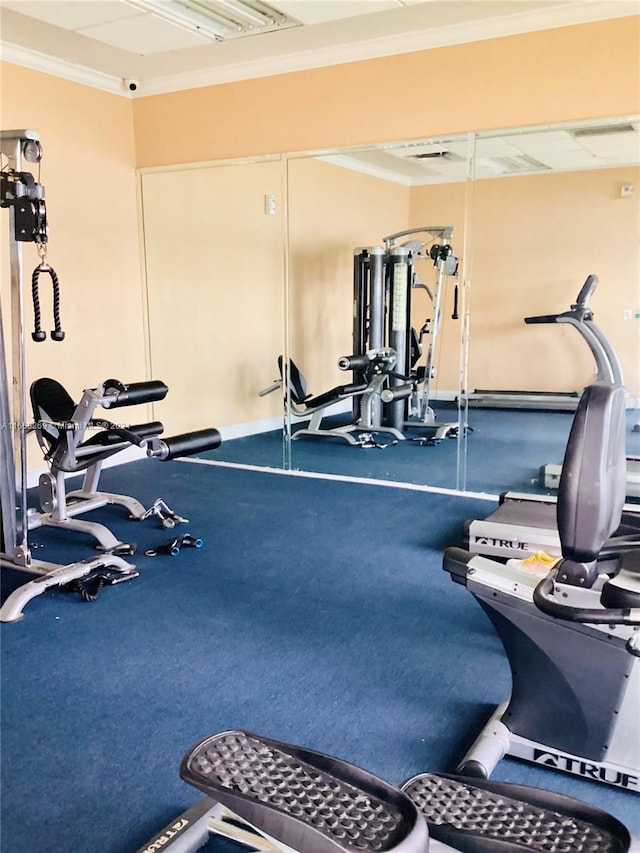 exercise room with ornamental molding