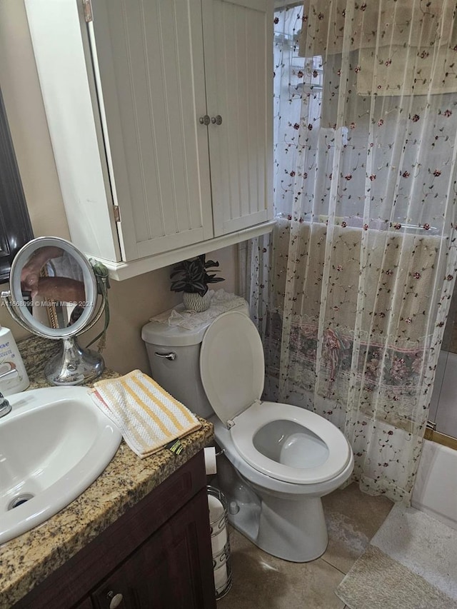 full bathroom with vanity, tile patterned floors, toilet, and shower / tub combo with curtain