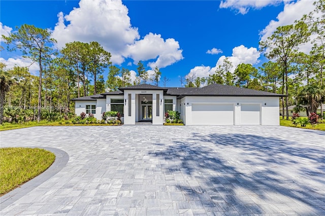 prairie-style home featuring a garage