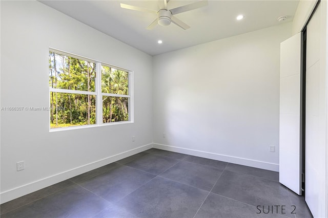 unfurnished room featuring ceiling fan