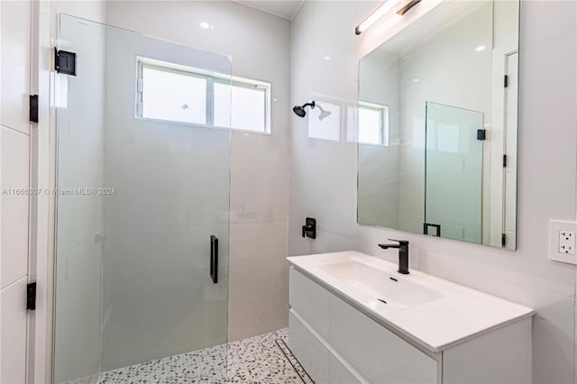 bathroom with vanity and an enclosed shower