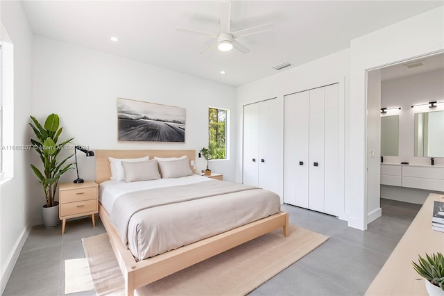 bedroom featuring two closets and ceiling fan