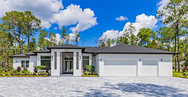 prairie-style house featuring a garage