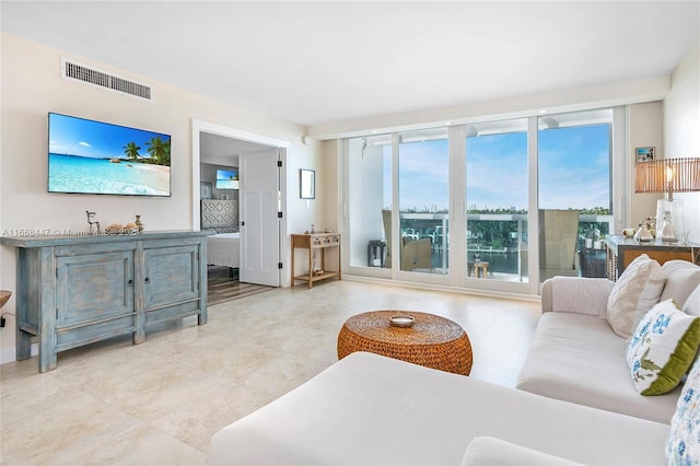 living room with floor to ceiling windows