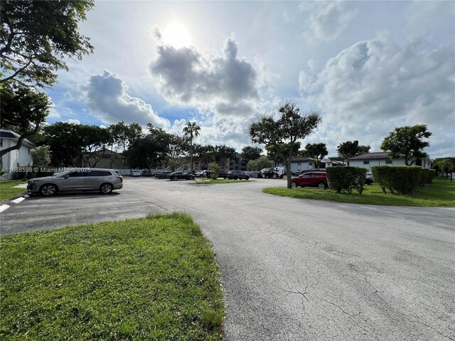 view of property exterior with a yard